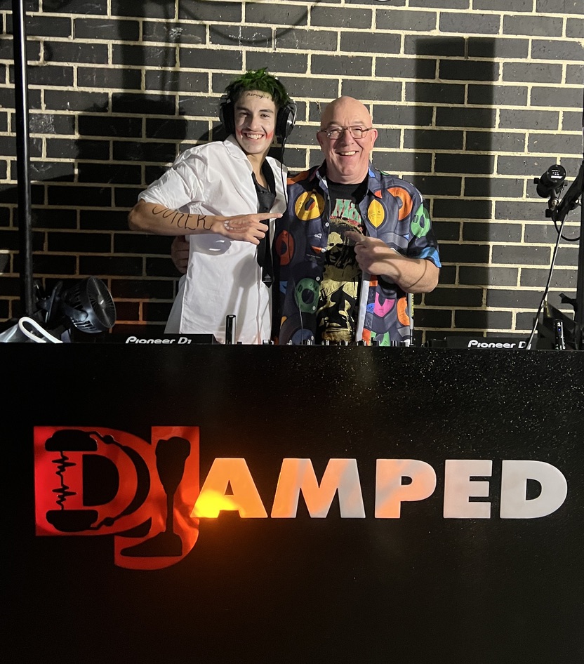 Cooper and AMPT Australia smiling behind the AMPT booth