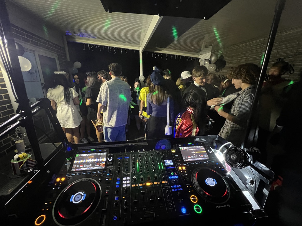 Pioneer DJ decks overlooking a packed outdoor dance floor