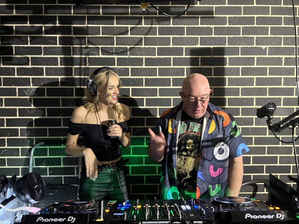 AMPT Australia showing a guest the Pioneer DJ controls