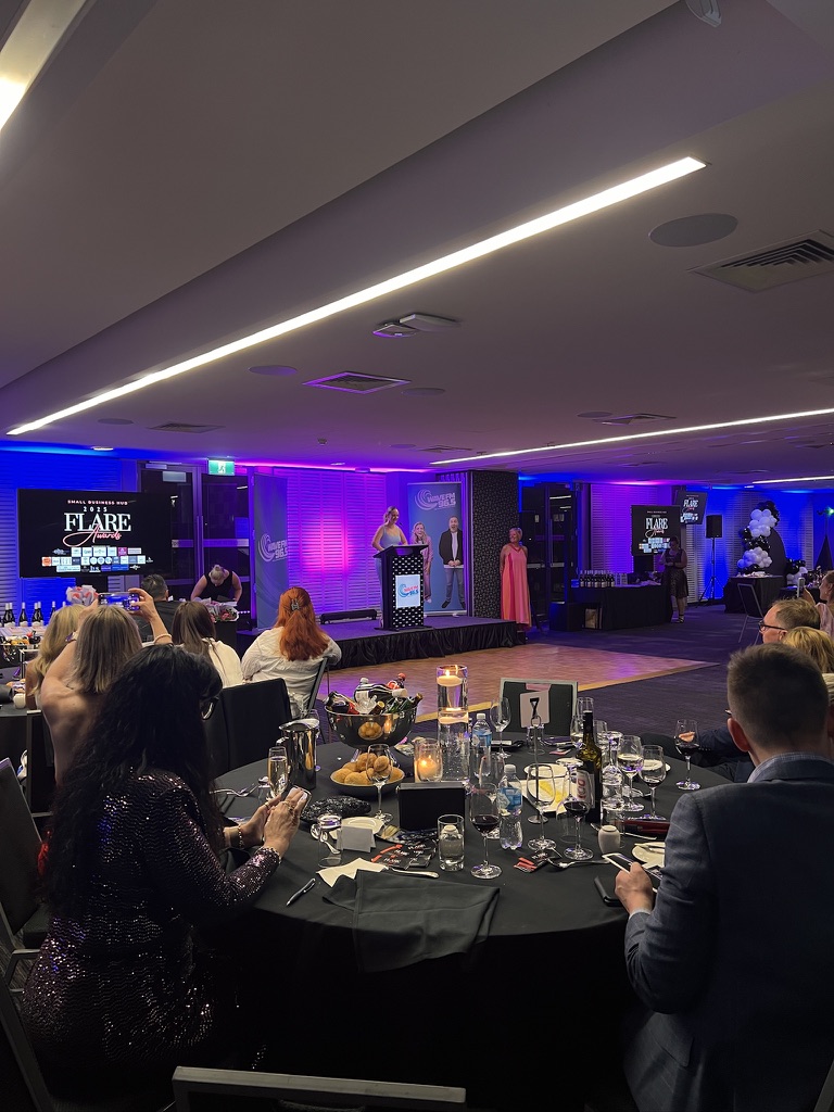 Guests watching the Flare Awards stage presentation