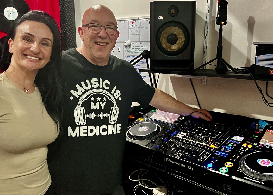 AMPT Australia with an adult DJ student beside the professional decks