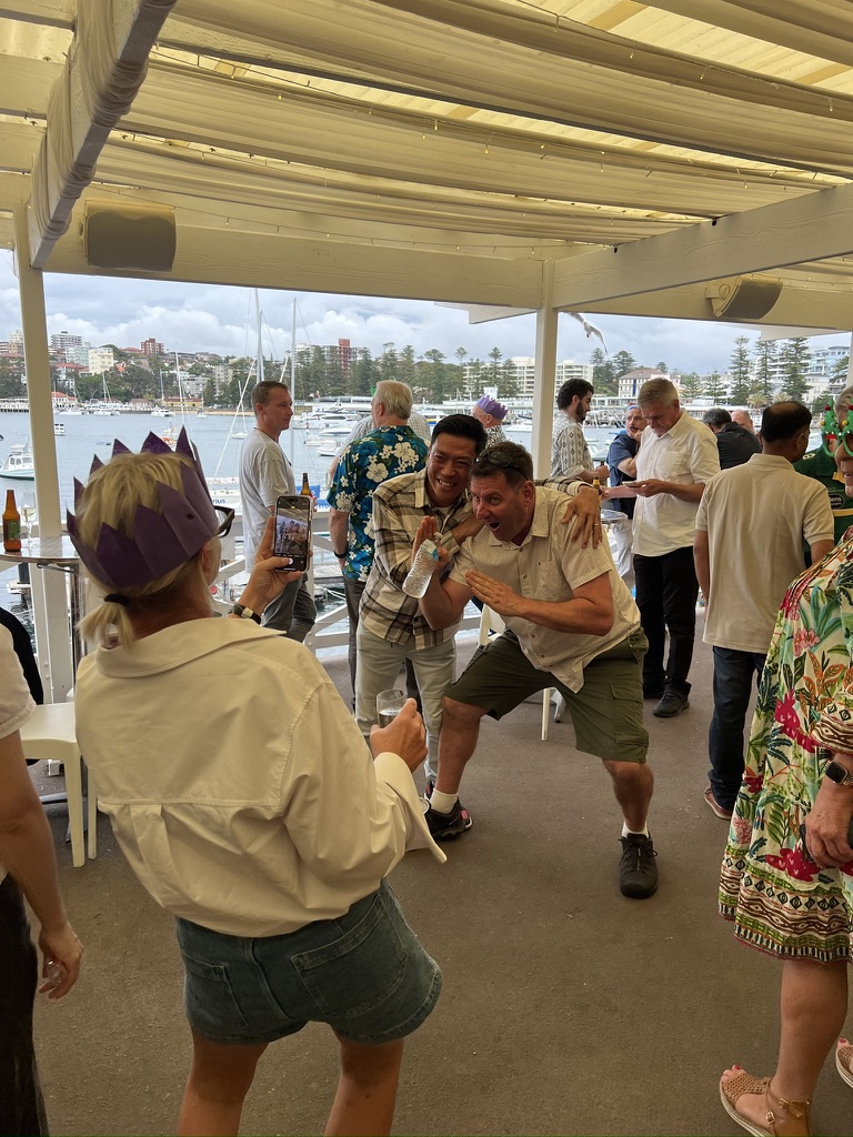 Guests posing for a photograph on the terrace