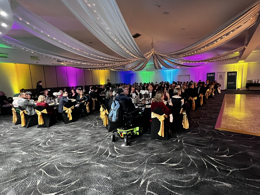 Guests seated beneath draped lighting at the Showtime fundraiser