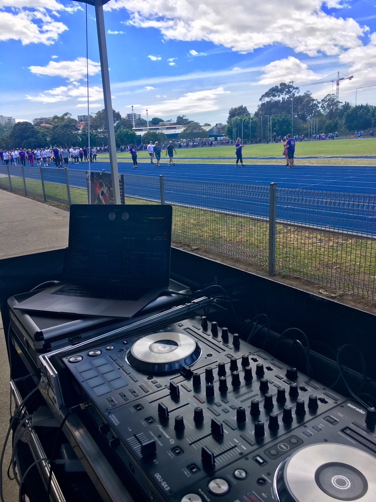 AMPT DJ controller and laptop overlooking the Walk4BrainCancer track