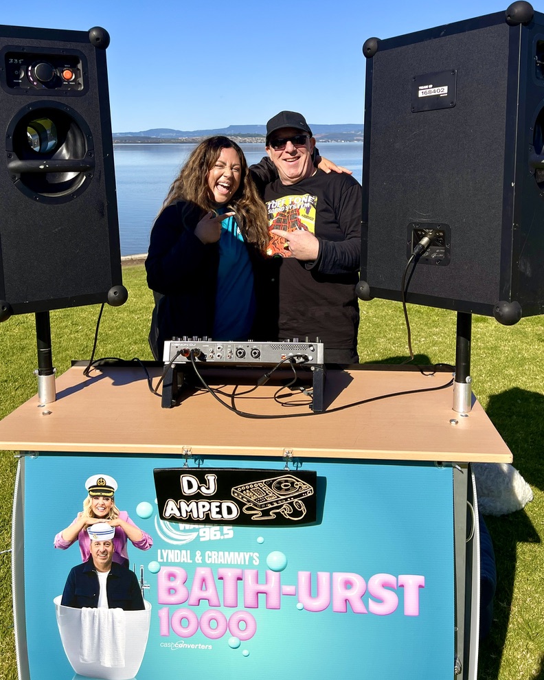 AMPT Australia posing with a guest at the Wave FM DJ booth
