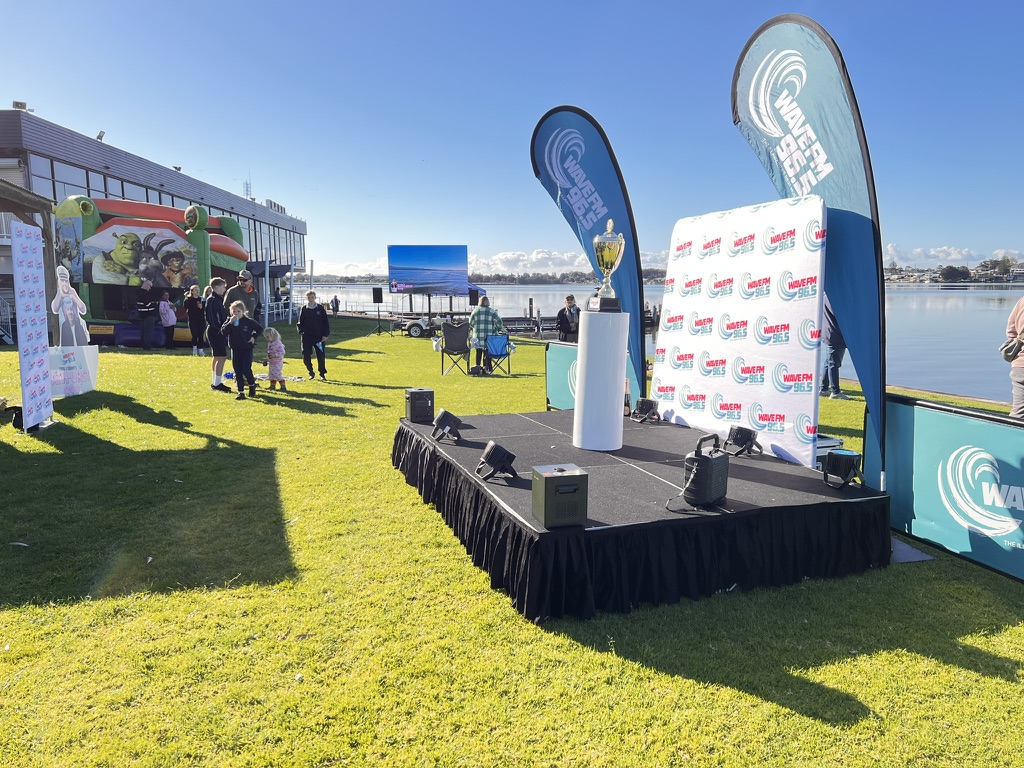 Wave FM outdoor corporate event stage and waterfront setting