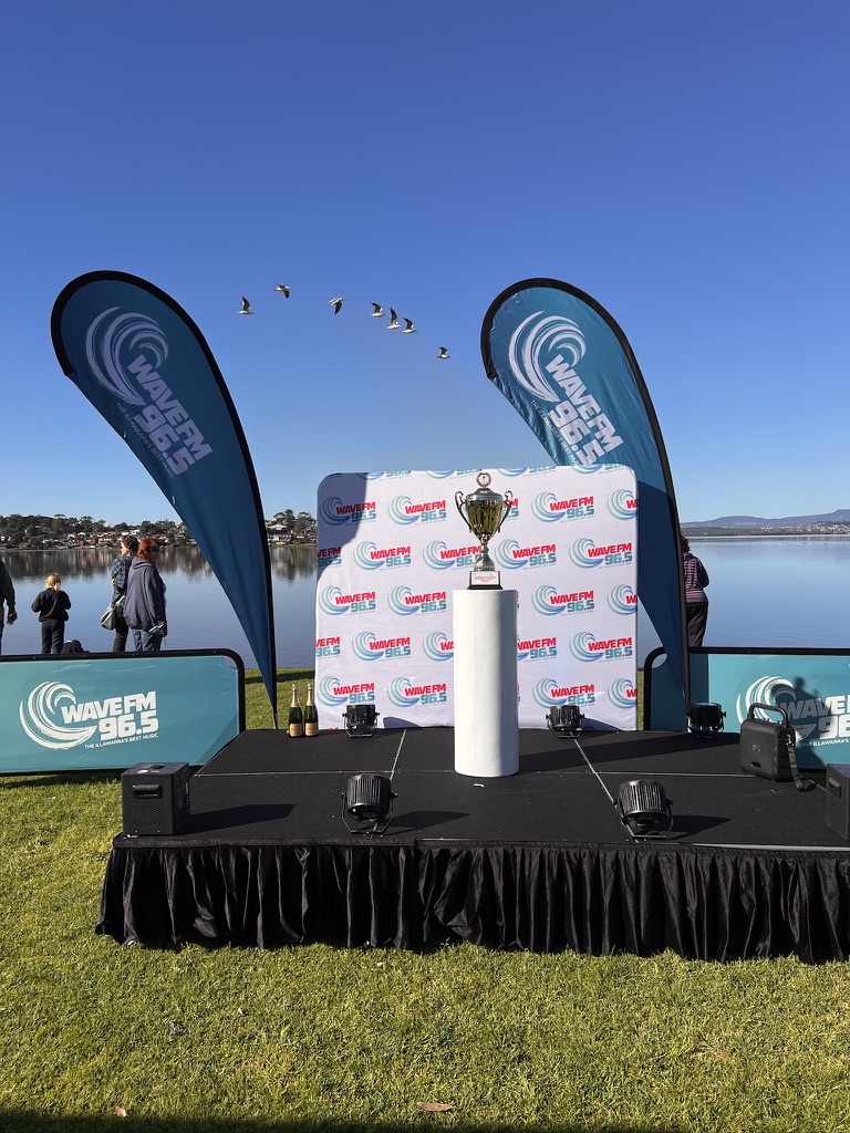 Wave FM branded outdoor corporate event stage