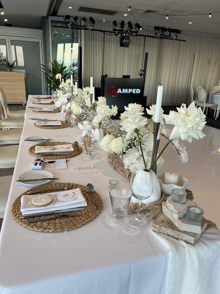 Wedding table styling with the AMPT DJ booth in the background